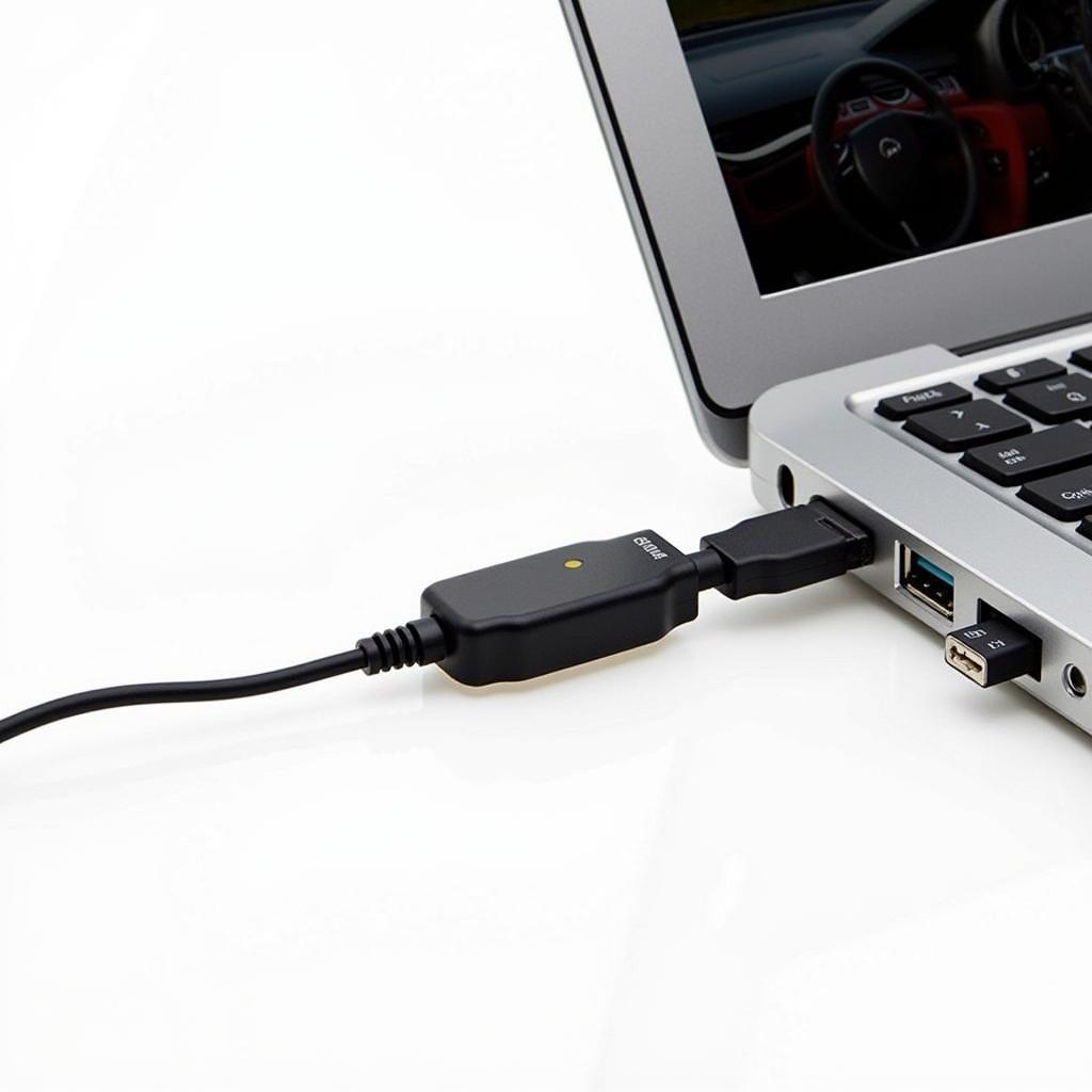 OBD-II adapter plugged into a laptop and connected to a car's diagnostic port.